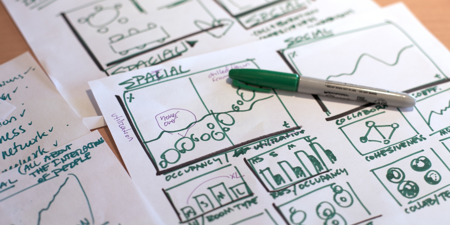 Sketches of paper-based design prototypes with data graphs and markings