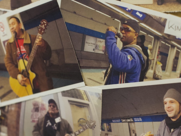 Photos laid out on a table of street music buskers in Chicago